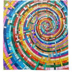 a colorful circular design made out of colored glass tiles on a white background with the words,