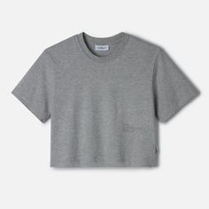 Streamline your wardrobe with The LOWGO Crop Tee, a shorter take on our signature LOWGO Tee. Made from soft, medium-weight 220gsm, 100% organic cotton, this t-shirt offers the same understated elegance with a modern, cropped silhouette. The subtle tone-on-tone logo, placed lower, discreetly nods to the brand’s commitment to refined minimalism, making it an effortless choice for those who appreciate subtle sophistication. Heather Grey Cotton T-shirt For Loungewear, Gray Boxy Fit Cotton T-shirt, Gray Boxy Cotton T-shirt, Basic Boxy Fit Organic Cotton T-shirt, Organic Cotton Short Sleeve Tops, Organic Cotton Crew Neck Cropped T-shirt For Summer, Heather Grey Cotton T-shirt For Summer, Sporty Heather Grey Tops For Everyday, Gray Cropped Cotton T-shirt With Short Sleeves