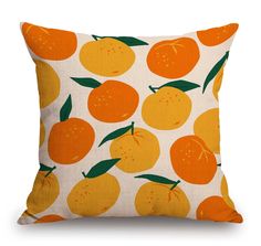 an orange print pillow on a white background