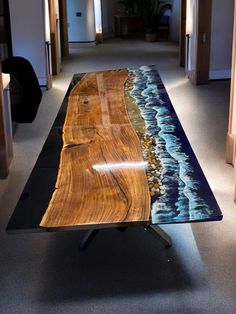 a wooden table sitting on top of a carpeted floor