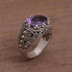 The radiant hue of amethyst dazzles the eye in this ornate cocktail ring. Handmade by Indonesian artisan Kadek Wijanegara the ring bears a gem weighing seven luscious carats. Sterling silver leaf motifs and gold plated dot accents adorn the ring's wide band. Purple Queen, Amethyst Cocktail Ring, Pearl Rings Vintage, Goth Accessories, Single Stone Ring, Pearl Rings, Fashion Skirts, Silver Link Bracelet, Rings Vintage