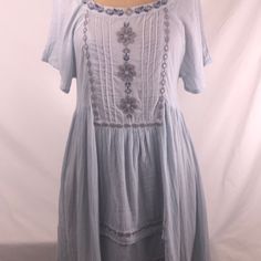 Stunning! This Is Such A Pretty Bluewater Navy, Gray And Silver Details. Square Neck In Front W Open Back High Low Hem. Comes Adjustable Cotton Slip. Two Side Pockets!!! I Bought This For Myself But Sadly Cannot Yet Wear A Small. Free People At Its Best Light Blue Cotton Bohemian Dress, Casual Light Blue Cotton Dress, Light Blue Short Sleeve Vacation Dress, Light Blue Short Sleeve Dress For Vacation, Light Blue Cotton Sundress For Spring, Light Blue Bohemian Knee-length Dress, Light Blue Knee-length Bohemian Dress, Light Wash Beach Dress For Summer, Light Blue Short Sleeve Mini Dress For Beach