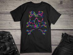 Skull Tee Shirt, Neon Skull Crossbones T-Shirt, Neon, Skull Crossbones, Colorful, Bones, Colorful Skull, Neon Skull, Neon Bones, * Classic fit * Clothing style: Athletic * Neckline: Crewneck * Sleeve length: Short sleeve Handmade in our shop with high quality retail printing on a quality Gildan Heavy Cotton t-shirt. Solid Colors - 5.3 oz.(US) 8.8 oz.(CA), 100% preshrunk cotton. Heather Colors - 5.3 oz.(US) 8.8 oz.(CA), 50% cotton/50% polyester. Antique Colors - 5.3 oz.(US) 8.8 oz.(CA), 90% cotton/10% polyester. Care Instructions Wash in cold/warm water and tumble dry with low heat turning the shirt inside out. Do not iron. Sizing (Unisex) - Also see size chart in images. Body Length - Measured from the highest part of the shoulder to the bottom hem. (SM-28", MD-29", LG-30", XL-31", 2X-32", Halloween Multicolor Skull Print Tops, Multicolor Skull Print Tops For Halloween, Multicolor Skull Print Crew Neck Top, Multicolor Skull Print T-shirt With Crew Neck, Multicolor Crew Neck T-shirt With Skull Print, Neon Skull, Skull Crossbones, Colorful Skulls, Skull Tee