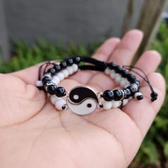 MADE TO ORDER MATERIAL- WHITE BRACELET... 6mm white matte beads 6mm silver and black spacer beads white yang charm connector black nylon cord BLACK BRACELET.... 6mm onyx black beads 6mm silver and black spacer beads black yin charm connector black nylon cord What does yin-yang symbolize? Image result for yin yang meaning in love Yin and yang (or 陰 and 陽 in traditional Chinese characters) represent duality, or the idea that two opposite characteristics can actually exist in harmony and complement White Spiritual Braided Bracelets For Friendship, White Hypoallergenic Spiritual Friendship Bracelets, White Round Friendship Bracelets, White Beaded Bracelets For Couples, White Round Braided Bracelets For Friendship, White Round Braided Friendship Bracelets, Adjustable White Braided Bracelet, Couples White Bracelet For Friendship, Yin Yang Friendship Bracelet