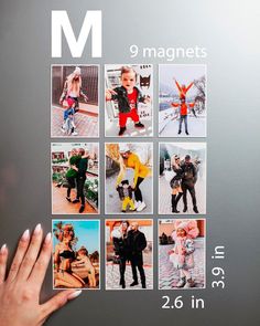 a person's hand is touching the magnets on a wall with pictures of people