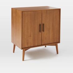 a wooden cabinet with two doors and legs