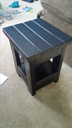 a coffee table sitting on top of a carpeted floor