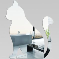 a mirror that has a cat on it in front of a bathtub and sink