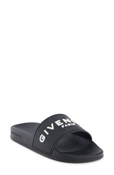 A dimensional Givenchy logo stands out on the wide strap of a laid-back slide sandal grounded with a star-studded sole. Synthetic upper, lining and sole Made in Italy Men's Designer Shoes Black Slides With Logo For Summer, Black Logo Slides For Summer, Black Slides With Logo, Black Logo Slides, Designer Open Toe Slides With Rubber Sole, Black Slides With Studded Rubber Outsoles, Gift Logo, Givenchy Logo, Givenchy Man