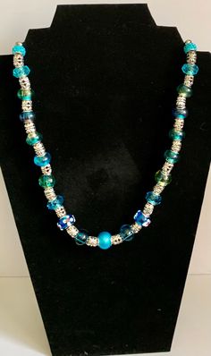 Beautiful handmade statement necklace. One Of A Kind Adjustable Necklace For Parties, Bohemian Single Strand Necklace For Party, Bohemian Glass Necklace For Party, Long Glass Necklace For Party, Artisan Necklace With Unique Variations For Party, Turquoise Necklace With Large Beads For Party, Turquoise Glass Necklaces With Large Beads, Handmade Long Glass Necklace, Unique Long Necklace With Large Beads As A Gift