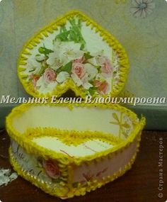 two yellow and white dishes with flowers on them