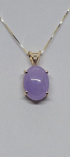 14k Yellow Gold Oval Natural Color Lavender Jade Pendant / Necklace /Charm in 14k Yellow Gold 18 Inches Chain. Good Jade quality Product Info: - Stone: Oval Lavender Jade. -Metal: 14k Yellow Gold. -Pendant Measures: 20 x 10mm. -Jade Measures: 11x8mm -Chain length: 18 Inches. -Nice Gift Box Included. Purple Oval 14k Stamped Jewelry, Fine Jewelry Lavender Oval Jewelry, Classic Lavender Oval Jewelry, Classic Oval Lavender Jewelry, Oval Jade Gold Necklace, Lavender Oval Fine Jewelry, Jade Oval Pendant Necklace With Natural Stones, Vintage Oval Jade Necklace, Luxury Jade Pendant Necklace