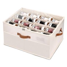 a white storage box filled with lots of different types of shoes