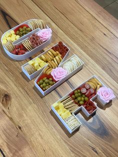 three trays filled with different types of snacks