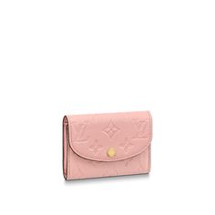 The rosalie coin purse is crafted from supple, grained monogram empreinte leather, which is embossed with the iconic monogram pattern. This tiny, feminine purse features a rounded flap secured by a gold-tone, louis vuitton-engraved press-stud. As well as a zipped pocket for coins, it offers a flat pocket and two card slots. Louis Vuitton Rosalie Coin Purse, Feminine Purse, Louise Vuitton, Pink Monogram, Girly Accessories, Louis Vuitton Official, Wallet Pouch, Pretty Bags, Small Leather Goods