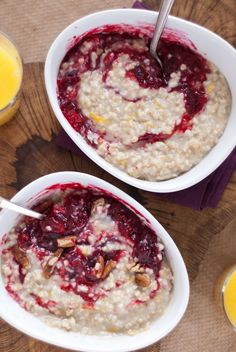 two bowls filled with oatmeal and orange juice