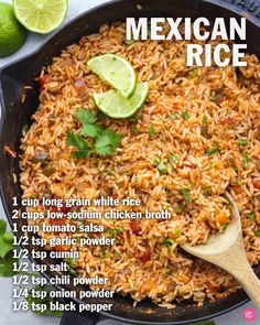 mexican rice in a skillet with limes and cilantro on the side