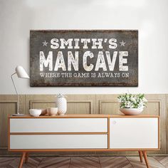 a sign that says smith's mancave where fish game is always on