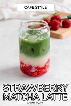 strawberry matcha latte in a glass jar with strawberries on the side and text overlay reading cafe style strawberry matcha latte