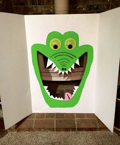 an open book with a green monster's mouth