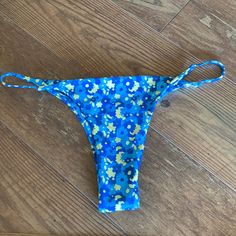 Cheeky/ Never Worn Fun Blue Bottoms For Poolside, Fun Blue Poolside Bottoms, Fun Blue Swimwear For Summer, Fun Blue Swimwear For Beach Season, Fun Blue Bottoms For Vacation, Blue Floral Print Bottoms For Poolside, Fun Blue Swimwear For Sunbathing, Blue Printed Bottoms For Sunbathing, Blue Fun Swimwear For Beach Party