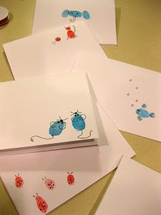 four cards with ladybugs on them sitting on a table next to each other