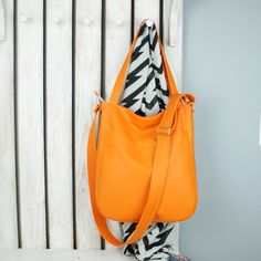 This orange faux leather 2in1 hobo purse with zipper looks great as shoulder handbag or vegan crossbody tote bag. Fits really well with any womens casual outfit. One of the bags perfect for everyday use. DETAILS shown: color: orange pattern: 2in1 bag size: (L) arge   width: 28-32 cm + 8 cm sides and bottom/ 11- 12,5 in + 3 in sides and bottom height: 40 cm / 15, 5 in  adjustable crossbody strap: 65-125 cm / 25,5-49 in It holds the format a4 - done very carefully, - aesthetic finish,  - fastened Leather Hobo Handbags, Messenger Purse, Vegan Handbags, Hobo Handbag, Hobo Purse, Crossbody Tote Bag, Orange Bag, Orange Leather, Crossbody Tote