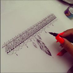 someone is drawing something on paper with markers