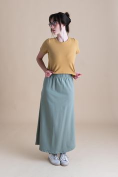 The Lounge Maxi Skirt is both flattering and simple, this skirt is a fantastic way to lounge or it can be dressed up and taken out for dinner or work. It travels well, and looks great with our crop tees and cardigans. Our Lounge Collection features the softest and stretchiest organic cotton French Terry! You can freely move or lounge in long-lasting 95% organic cotton and 5% spandex. Feel completely at ease in soft earth tones, 4-way stretch, and fabric that is just so flattering for all bodies. Modest Fitted Skirt With Elastic Waistband, Versatile Relaxed Fit Gathered Maxi Skirt, Versatile Lined Maxi Skirt For Day Out, Modest Stretch Maxi Skirt, Versatile Long Lined Skirt, Versatile Flared Skirt For Day Out, Versatile Relaxed Maxi Skirt With Lining, Versatile Relaxed Maxi Skirt With Lined Detail, Relaxed Solid Color Maxi Skirt For Day Out