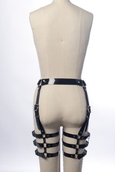 For many years I struggled to design a leg harness (a highly requested item) that I was happy with. It needed to be adjustable in all the right places for a detailed fit and range of motion, yet be structured enough so the straps wouldn't need constant adjustment or slide around while wearing it. Thanks to an inquiry from my friend DJ JQ, I got the push to really come up with something and this is the result. Designed to sit right at the natural waist, with four vertical buckled straps. Three ho Strapped Gothic Harness For Cosplay, Gothic Strapped Harness For Cosplay, Adjustable Strapped Harness For Cosplay, Punk Strapped Harness For Cosplay, Punk Harness With Adjustable Straps, Adjustable Edgy Harness For Cosplay, Adjustable Strapped Gothic Harness, Black Gothic Harness With Straps, Gothic Black Harness With Straps