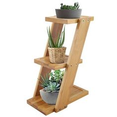 three tiered wooden plant stand with succulents