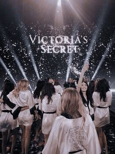 the victoria's secret show is being filmed on stage with people dressed in white