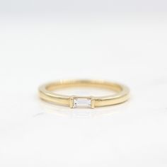 Wedding Band The Single Baguette Ring Minimalist Baguette Diamond Ring For Formal Occasions, Modern Everyday Diamond Ring With Baguette Diamonds, Classic Baguette Diamond Promise Ring, Classic Baguette Rings For Everyday, Minimalist Emerald Cut Diamond Ring With Baguette Diamonds, Minimalist Emerald Cut Diamond Ring For Everyday, Minimalist Stackable Baguette Cut Rings For Formal Occasions, Minimalist Everyday Stackable Rings With Baguette Cut, Everyday Diamond Stackable Rings With Baguette Cut