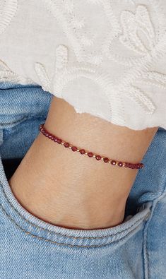 Delicate bracelet with red garnet and gold beads. Tiny wine red beads are interspersed with gold filled beads giving the bracelet a minimal chic look. Strung on durable fiber thread making the bracelet very comfortable to wear. Closes with a gold filled spring ring clasp and comes with an extender chain. It's minimalist design makes this bracelet a must-have piece great for everyday wear!  M O R E * C O L O U R S The bracelet is also available in other gemstones, see photo 9 and this section for Red Beaded Bracelet, Red Bracelet, Garnet And Gold, Beads Bracelet Design, Garnet Bracelet, Red Beads, Red Bracelets, Minimal Chic, Red Bead