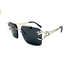 This Gold/Silver Framed Rectangle Shaped Color Sunglass is a luxurious piece with strong Gold accent metal frames with a Panther design on the side and UV Ray Protection. Both Men and Women can rock this piece. We strive to offer the most exquisite pieces at the best prices in the game so don't hesitate when adding multiple items to your cart. The perfect accessory to any outfit, casual or business, this piece will turn heads in just the right way Perfect to pair with any Watch, Chain, Bracelet or Pendant from our store^^ Item #: 09450 Metal Sunglasses With Tinted Lenses For Evening, Evening Metal Sunglasses With Tinted Lenses, Silver Shield Sunglasses With Glass For Summer, Silver Shield Sunglasses In Glass For Summer, Silver Glass Shield Sunglasses For Summer, Silver Rimless Shield Sunglasses With Mirrored Lenses, Silver Rimless Sunglasses For Party, Trendy Metal Sunglasses For Evening Wear, Silver Rectangular Sunglasses With Mirrored Lenses