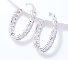 The ever-popular hoop now comes with a splash of sparkle! Not too big, not too small, these earrings get a brilliant update from style staple to style maker thanks to a radiant row of Diamonique simulated diamonds. Sparkling Diamond White Hoop Earrings, Silver Glamorous Hoop Earrings For Anniversary, Glamorous Silver Hoop Earrings For Anniversary, Small Hoop Earrings In White Cubic Zirconia, Small Hoop White Cubic Zirconia Earrings, White Cubic Zirconia Small Hoop Earrings, Silver Bling Hoop Earrings For Anniversary, Dazzling White Sparkling Hoop Earrings, Round Hoop Earrings With Bling For Anniversary