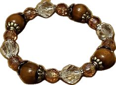 Brown Spiritual Bangle Jewelry, Casual Brown Bracelet Jewelry, Adjustable Brown Hand-strung Crystal Bracelet, Adjustable Hand-strung Brown Crystal Bracelet, Casual Brown Round Beaded Jewelry, Brown Wooden Beaded Bracelet, Brown Wooden Beads For Bracelets, Brown Beaded Bracelets With Round Beads For Gift, Spiritual Brown Round Beaded Bracelets