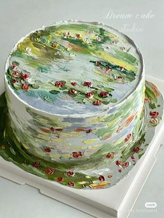 a cake decorated with water lilies on top of a white plate and serving tray