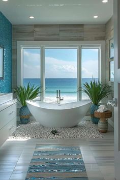 a large bath tub sitting in the middle of a bathroom next to a big window