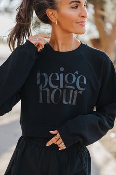 the cropped sweatshirt of your dreams and what you will now be grabbing to wear with every pair of leggings, bike shorts, or sweatpants! made with an incredibly soft yet not bulky material, this sweatshirt is great for throwing on before or after a workout (or even during!). relaxed oversized fit and a cropped length without being too short! this sweatshirt fits true to size! Black Cropped Sporty Sweatshirt, Sporty Black Cropped Sweatshirt, Athleisure Crop Top With Letter Print And Crew Neck, Fall Workout Tops With Letter Print, Sporty Black Cropped Sweater For Streetwear, Cropped Athleisure Sweatshirt For Streetwear, Fall Athleisure Cropped Sweater For Streetwear, Fall Activewear With Graphic Print And Relaxed Fit, Black Sporty Cropped Sweater With Ribbed Cuffs