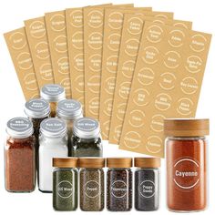 six spices are shown next to each other in glass jars with labels on the side