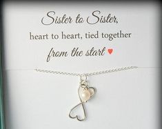 a necklace with a heart on it and a message about sister to be in love