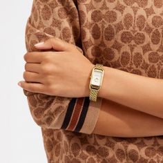 Inspired by the sleek designs of 1920s Art Deco the Cadie watch has an elegant long and lean silhouette. The gold tone bracelet timepiece features a dial detailed with our iconic Horse and Carriage motif. | Coach Cadie Watch, 20 Mm X 32.5 Mm - Women's - Gold Coach Women Watch, Luxury Coach Jewelry With Polished Finish, Luxury Coach Watch For Formal Occasions, Coach Cadie Watch, Square Watches, Vintage Gold Watch, Art Deco Watch, Coach Watch, Horse And Carriage