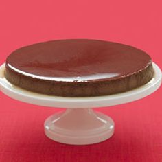 a chocolate cake sitting on top of a white plate