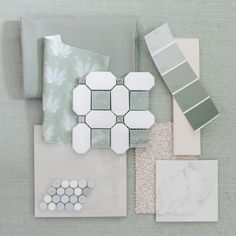 some white and green items sitting on top of a table next to each other with different color swatches