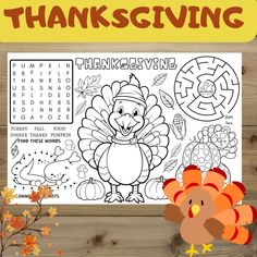 the thanksgiving turkey coloring page is shown on a wooden table with fall leaves and pumpkins