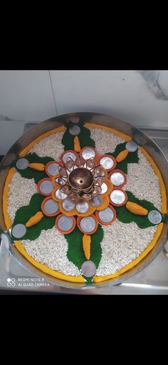 an elaborately decorated platter with utensils on it's side, in the shape of a flower