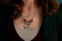 a close up of a person wearing a necklace