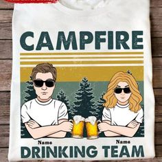 Campfire Drinking Team Personalized Shirt, Gift For Camping Lovers Discover Our Latest Collection Of Versatile And Stylish T-Shirts (Gildan 5000), Where Fashion Meets Ultimate Comfort! Offered In Sizes Ranging From S To 3xl And A Vibrant Spectrum Of Colors Including Black, White, Sand, Green, Sport Grey, Red, Navy, And More, There's An Option To Cater To Every Taste. Crafted With Expertise Using Premium Materials, Our T-Shirts Provide A Luxurious Sensation And An Impeccable Fit That Lasts All Da Luxury White Short Sleeve Camp Shirt, Drinking Team, Camping Lovers, Personalized Shirts, Personalized T Shirts, Grey And Gold, Campfire, Sloth, Special Gifts