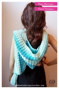 a woman wearing a blue crochet shawl over her shoulder with the words free pattern on it